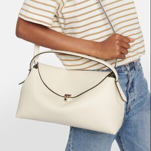 TOTEME T-Lock Top Handle Bag in Pebble Grain Leather Color: Milk